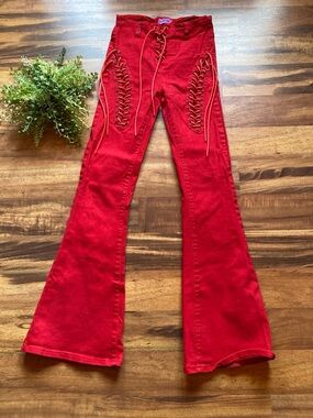 Edickted Small red lace up flared jeans